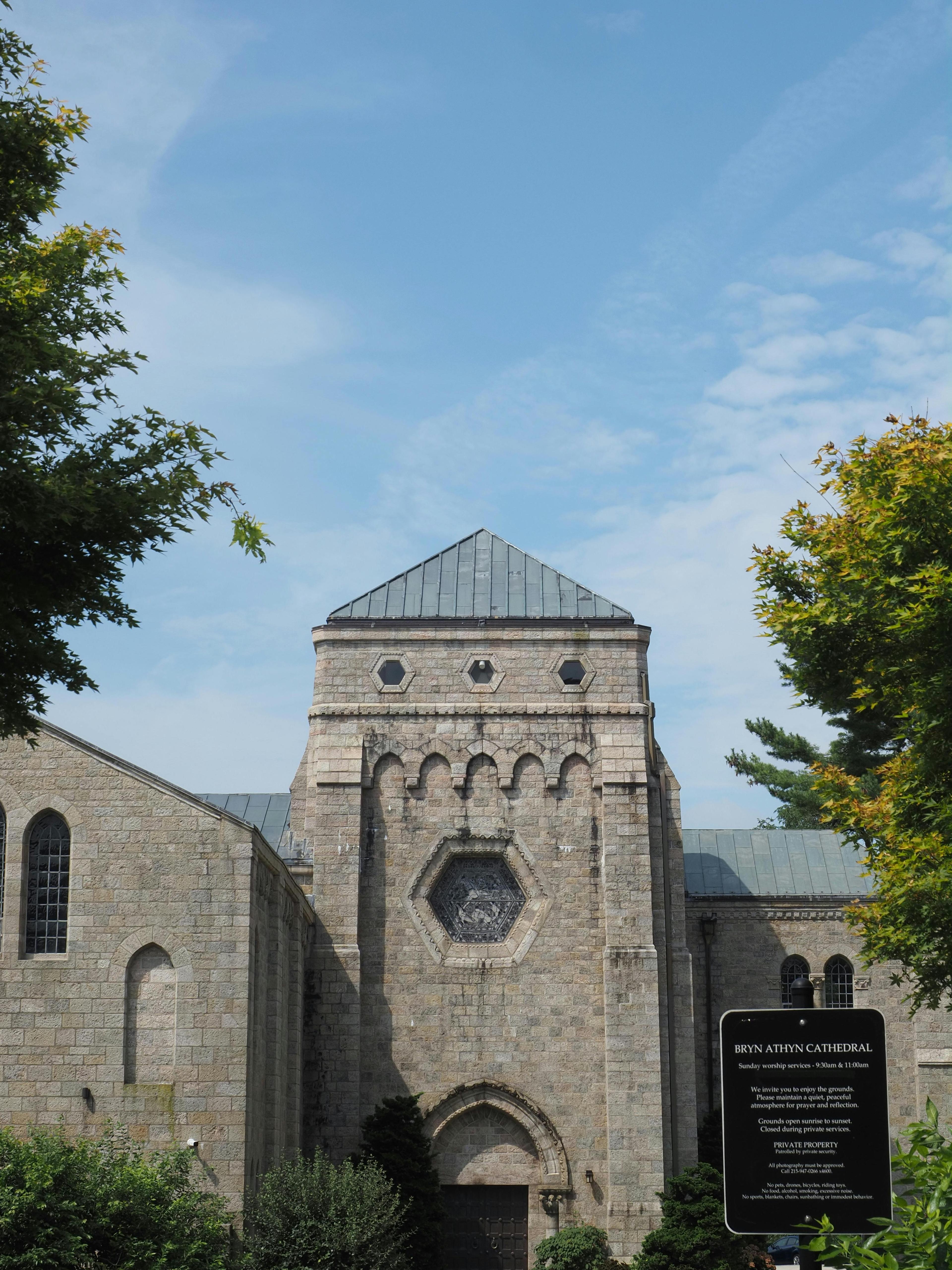 Magnificent view of the Bryn Athyn Cathedral exterior under a clear blue sky.